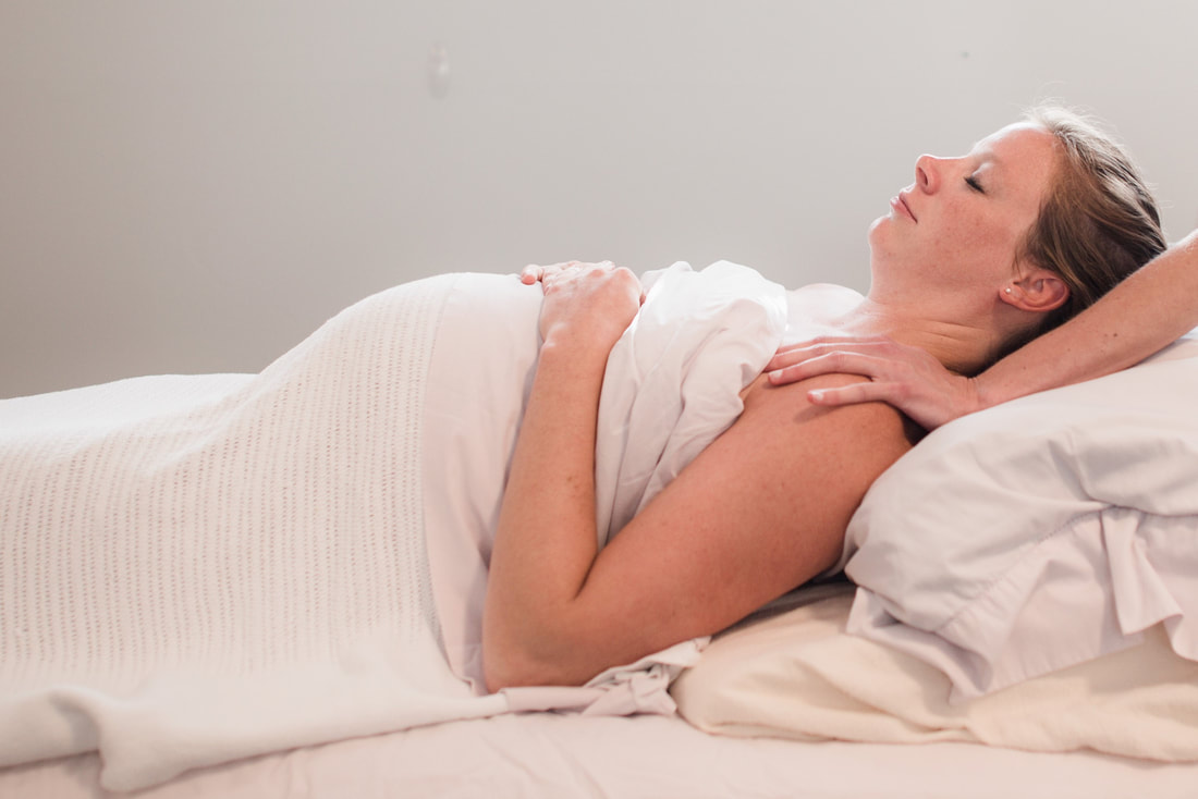 Pregnant woman receiving massage